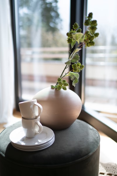 white ceramic teacup on white ceramic saucer